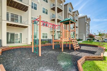 a playground at the whispering winds apartments in pearland, tx